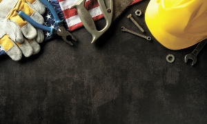 Industrial,Tools,On,Dark,Background,With,American,Flag,And,Hard